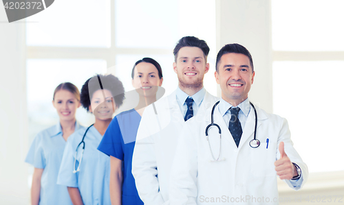 Image of group of happy doctors at hospital