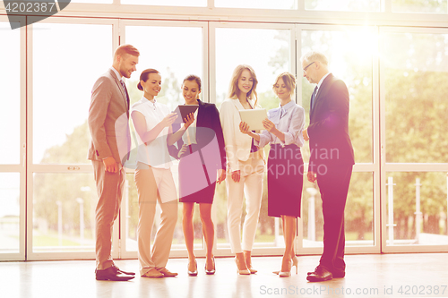 Image of business people with tablet pc computers at office