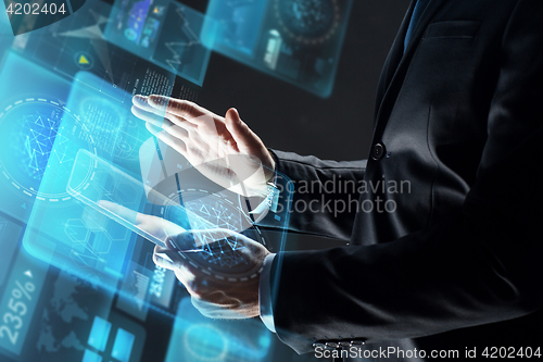 Image of close up of businessman with transparent tablet pc