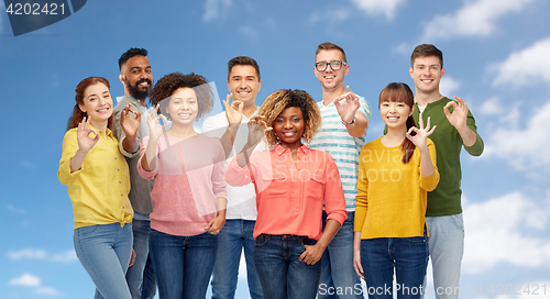 Image of international group of happy people showing ok