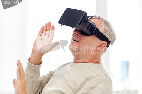 Image of old man in virtual reality headset or 3d glasses