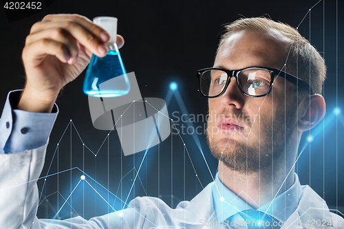 Image of young scientist holding test flask with chemical