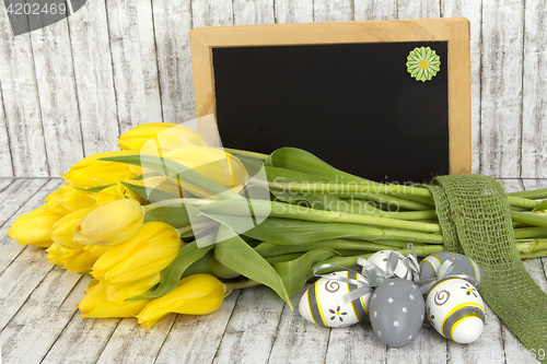 Image of Beautiful flowers and blank blackboard