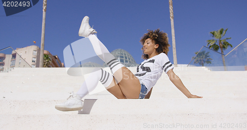 Image of Attractive female posing on stairs