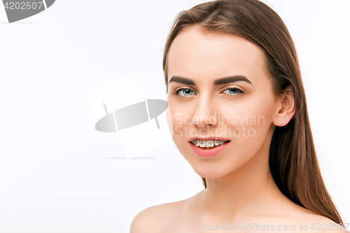 Image of Beautiful young woman with teeth braces