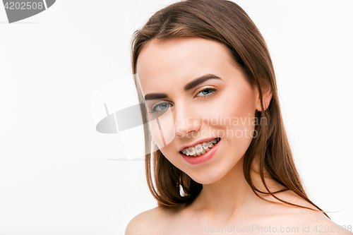 Image of Beautiful young woman with teeth braces