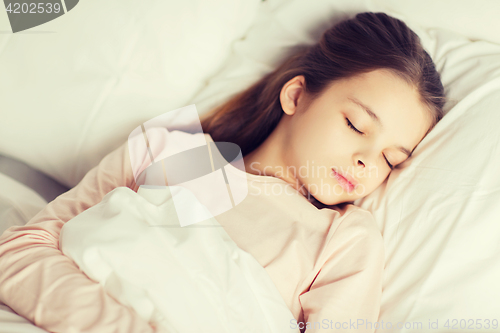 Image of girl sleeping in bed at home