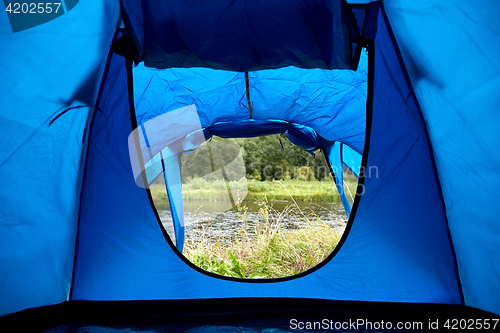 Image of natural view from outdoor camping tent door