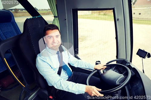 Image of happy driver driving intercity bus