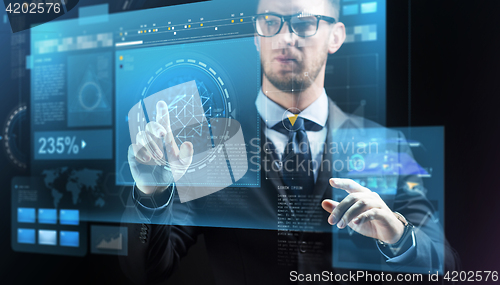 Image of close up of businessman with virtual screens