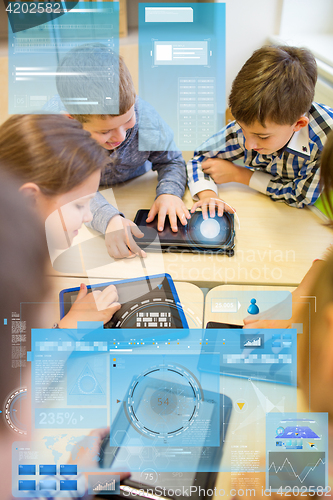 Image of group of school kids with tablet pc in classroom