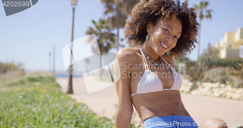 Image of Smiling female portrait wearing swimsuit