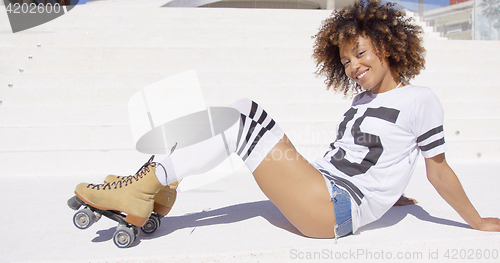 Image of Female wearing roller skates posing