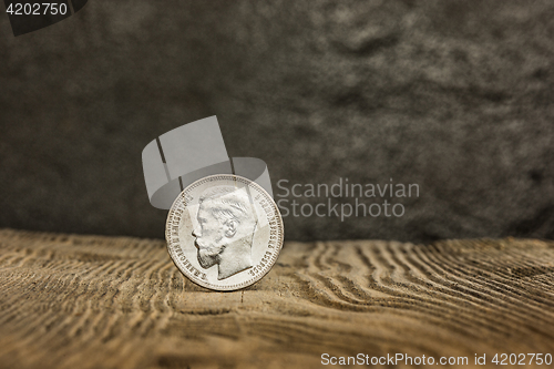 Image of Closeup of old russian coin on a wooden background.