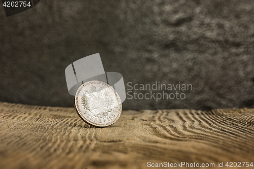 Image of Closeup of old russian coin on a wooden background.