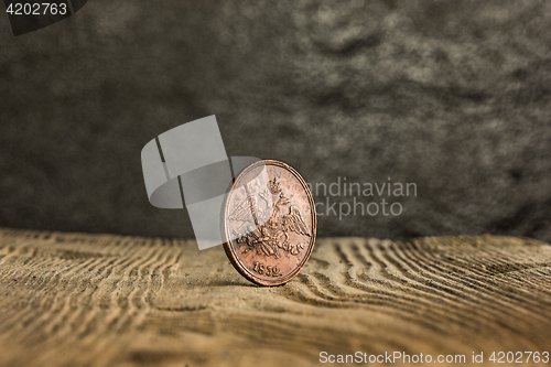 Image of Closeup of old russian coin on a wooden background.