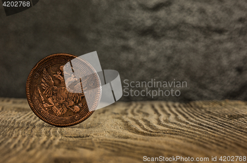 Image of Closeup of old russian coin on a wooden background.