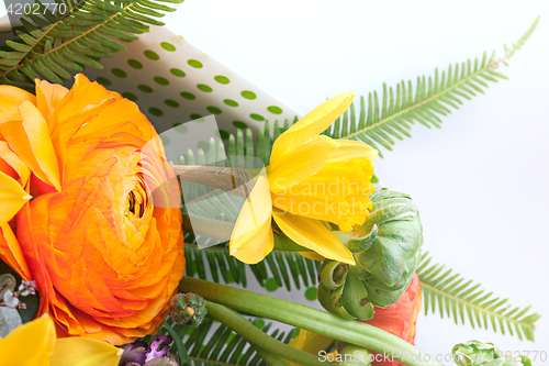 Image of Ranunkulyus bouquet of red flowers on a white background