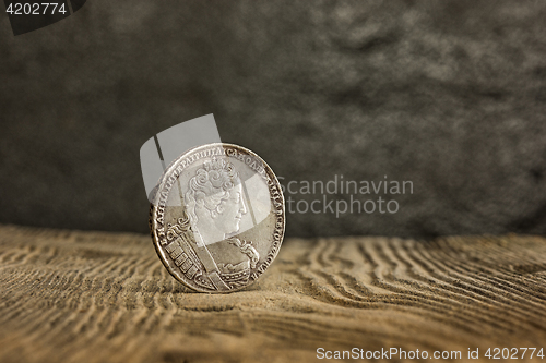 Image of Closeup of old russian coin on a wooden background.