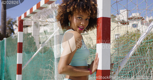 Image of Pretty female posing on playground