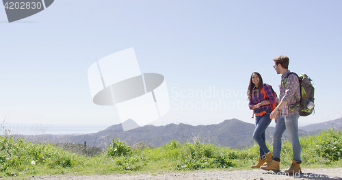 Image of Laughing couple in mountains