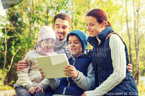 Image of happy family with tablet pc at camp