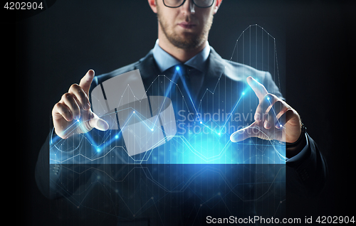 Image of close up of businessman with virtual diagram