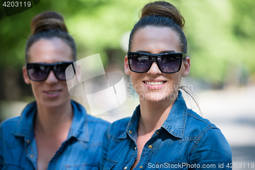 Image of twin sister with sunglasses