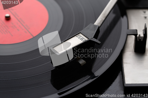 Image of Old vinyl record with player
