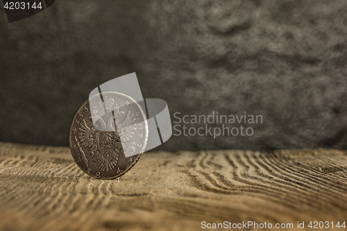 Image of Closeup of old russian coin on a wooden background.