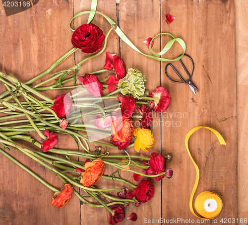 Image of Ranunkulyus bouquet of red flowers on a white background