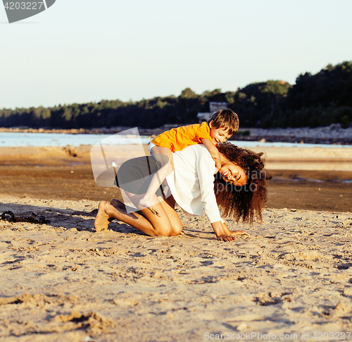 Image of pretty diverse nation and age friends on sea coast having fun, lifestyle people concept on beach vacations 