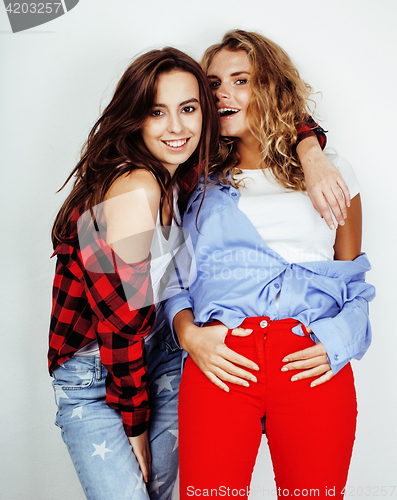 Image of lifestyle and people concept: Fashion portrait of two stylish sexy girls best friends, over white background. Happy time for fun. 