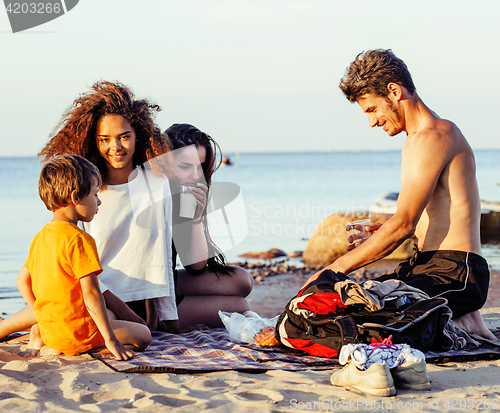 Image of pretty diverse nation and age friends on sea coast having fun, lifestyle people concept on beach vacations 