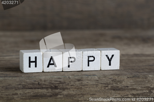 Image of Happy, written in cubes