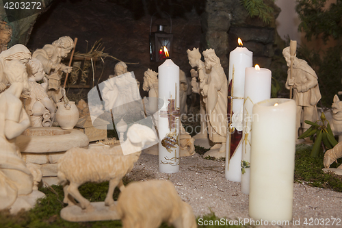 Image of Baptismal candles in a crib