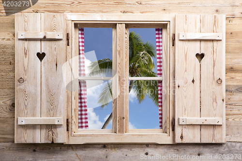 Image of Wooden window with tropical panorama view