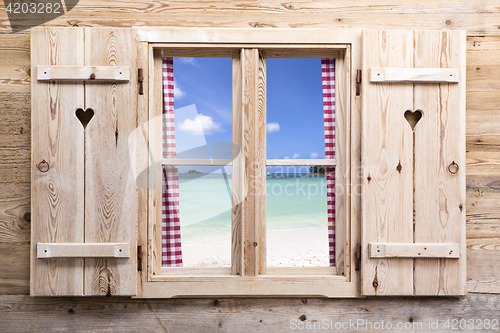 Image of Wooden window with beach panorama view