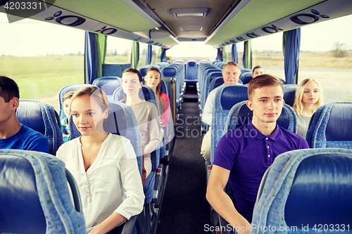 Image of group of passengers or tourists in travel bus