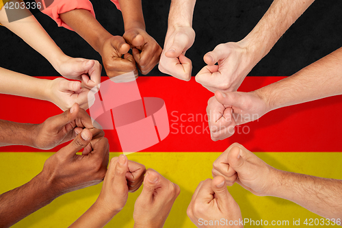 Image of hands of international people showing thumbs up