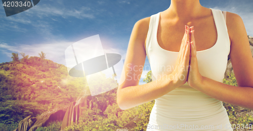 Image of close up of woman doing yoga outdoors