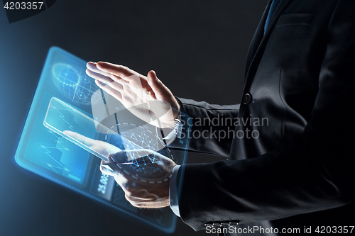 Image of close up of businessman with transparent tablet pc