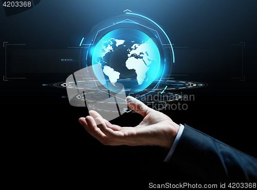 Image of businessman hand virtual earth projection