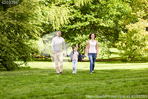 Image of happy family walking in summer park