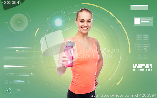 Image of happy sportive young woman with water bottle