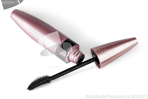 Image of Mascara and brush lying beside