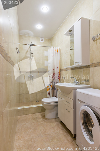 Image of Interior of a bathroom, a combined toilet and shower