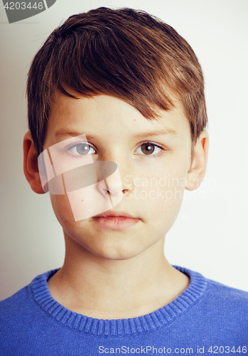 Image of young pretty little cute boy kid wondering, posing emotional face isolated on white background, gesture happy smiling close up, lifestyle people concept