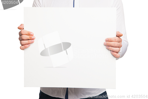 Image of close up of man hands showing white blank board