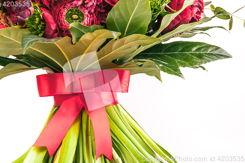 Image of Ranunkulyus bouquet of red flowers on a white background